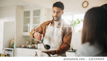 Home, kitchen and man with plate for serving, cooking and food preparation with chef for dinner. House, male person and cook with homemade dish for nutrition, meal ingredients and gourmet for lunch 126104045