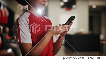 Sports, soccer and hands of woman with phone in locker room for social media, notification and communication. Athlete, football and person on smartphone for match, training and tournament schedule 126104049