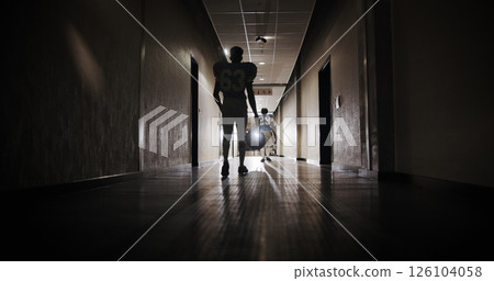 Back, football and walking with man in stadium corridor for sports competition, match and game. Fitness, pro league player and athlete with person in tunnel for training, tournament and contest Back, football and walking with man in stadium corridor for sports competition, match and game. Fitness, pro league player and athlete with person in tunnel for training, tournament and contest 126104058