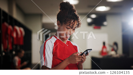 Sport, girl and smile in locker room with mobile, social media and check training schedule. Football player, woman and happy with phone for good news, league acceptance or favorite soccer team update 126104135