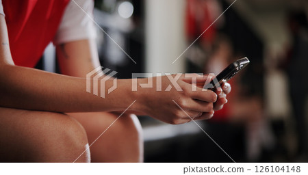 Athlete, soccer and hands with phone in locker room for social media, contact and communication. Sports, football and closeup of person on smartphone for match, training and tournament schedule 126104148