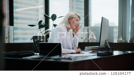 Mature woman, headache and stress at office by computer, tired and fatigue with deadline for admin. Person, migraine and frustrated with pain, burnout or brain fog with paperwork by PC in company Mature woman, headache and stress at office by computer, tired and fatigue with deadline for admin. Person, migraine and frustrated with pain, burnout or brain fog with paperwork by PC in company 126104177