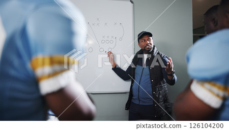 Whiteboard, team and man with football strategy in locker room for game plan or defense formation. Touchdown tactics, sports coaching and manager with people, match feedback and training analysis Whiteboard, team and man with football strategy in locker room for game plan or defense formation. Touchdown tactics, sports coaching and manager with people, match feedback and training analysis 126104200