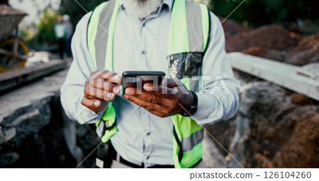 Construction site, hands and phone with person outdoor for communication, excavation or update. App, building and contact with professional developer typing on mobile for architecture or planning 126104260