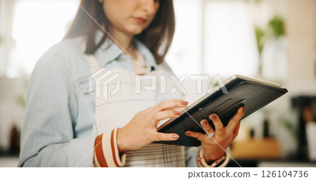Hands, tablet and woman in kitchen, cooking and digital app for online recipe, website info and instructions. Closeup, person and chef with tech, home and nutrition with ingredients and connection Hands, tablet and woman in kitchen, cooking and digital app for online recipe, website info and instructions. Closeup, person and chef with tech, home and nutrition with ingredients and connection 126104736