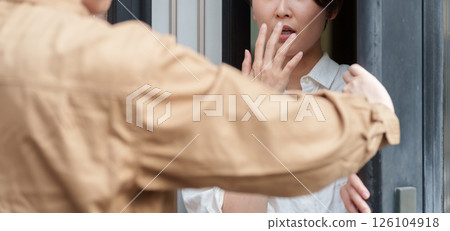 A woman dislikes a contractor who visits her house A woman dislikes a contractor who visits her house 126104918