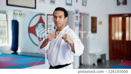 Portrait, man and karate in dojo for self defense training, challenge or skill with martial arts. Serious, male person in fight pose and gym for taekwondo, fitness and combat sports for exercise Portrait, man and karate in dojo for self defense training, challenge or skill with martial arts. Serious, male person in fight pose and gym for taekwondo, fitness and combat sports for exercise 126105008