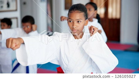 Punch, lesson and girl in karate dojo for self defense training, challenge or skill with martial arts. Children, female student and group for fight, class and taekwondo club with fitness or sports Punch, lesson and girl in karate dojo for self defense training, challenge or skill with martial arts. Children, female student and group for fight, class and taekwondo club with fitness or sports 126105027