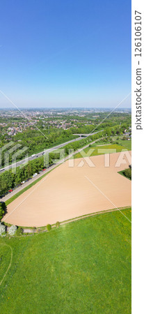 E19, Halle, Vlaams Brabant, Belgium, 27th of April, 2025, Aerial view shows fertile farmland by a E19, Halle, Vlaams Brabant, Belgium, 27th of April, 2025, Aerial view shows fertile farmland by a 126106107
