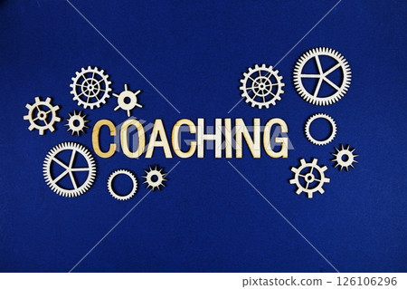 Coaching alphabet letters with gears element on navy blue background Coaching alphabet letters with gears element on navy blue background 126106296