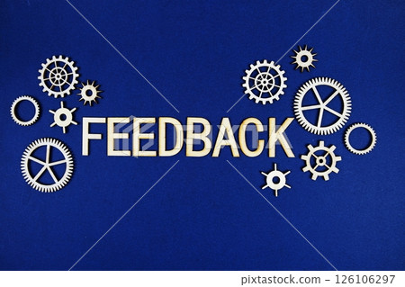 Feedback alphabet letters with gears element on navy blue background 126106297