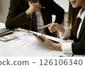 close up business meeting businessman and businesswoman sitting 126106340
