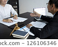 Lawyer discussing with legal businessman on table 126106346