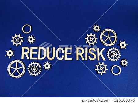 Reduce Risk alphabet letters with gears element on navy blue background Reduce Risk alphabet letters with gears element on navy blue background 126106370