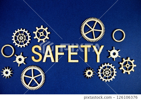 Safety alphabet letters with gears element on navy blue background 126106376