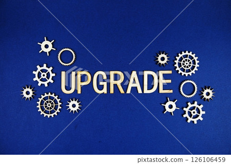 Upgrade alphabet letters with gears element on navy blue background 126106459