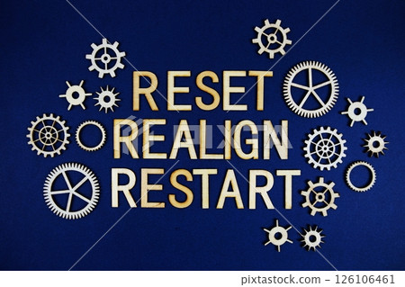Reset Realign Restart alphabet letters with gears element on navy blue background 126106461