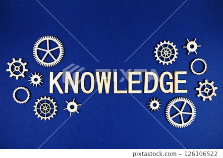 Knowledge alphabet letters with gears element on navy blue background 126106522