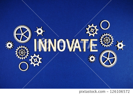 Innovate alphabet letters with gears element on navy blue background Innovate alphabet letters with gears element on navy blue background 126106572