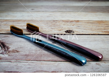 Toothbrushes flat lay on wooden background Toothbrushes flat lay on wooden background 126106587