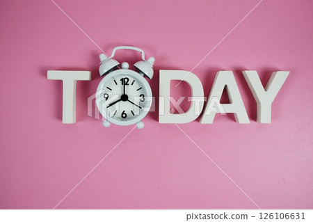 Today alphabet letters with alarm clock on pink background Today alphabet letters with alarm clock on pink background 126106631