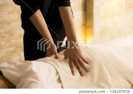 Senior woman receiving massage 126107656
