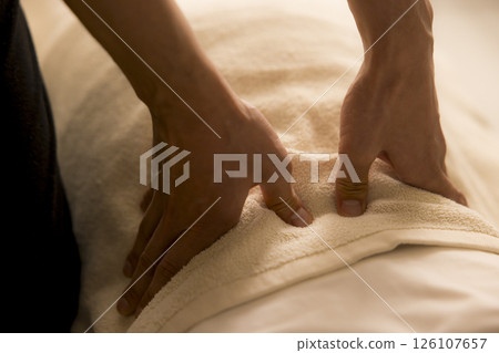 Senior woman receiving massage Senior woman receiving massage 126107657