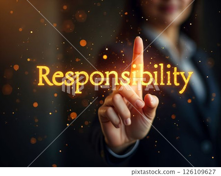 Individual demonstrating the concept of responsibility with illuminated text in a professional setting Individual demonstrating the concept of responsibility with illuminated text in a professional setting 126109627