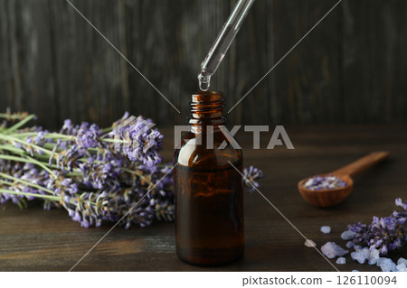 Lavender oil in a bottle with a dropper close-up 126110094