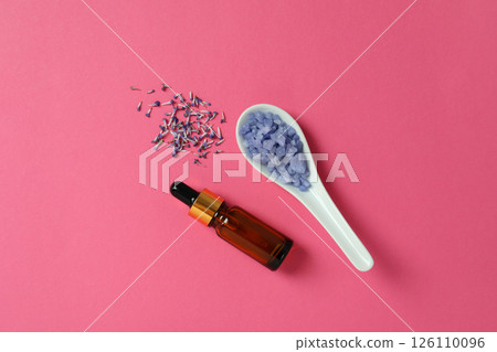 Lavender oil in a bottle with a lavender flower 126110096