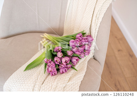Serene Tulip Bouquet on Cozy Armchair Serene Tulip Bouquet on Cozy Armchair 126110248