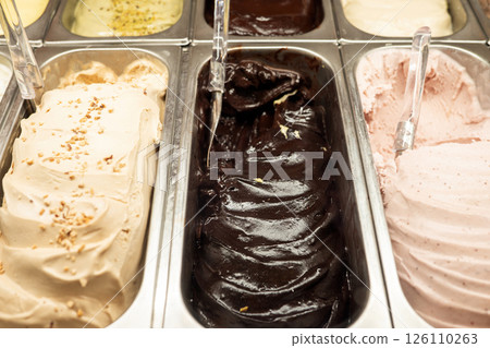 Delicious variety of gelato flavors in metal display trays Delicious variety of gelato flavors in metal display trays 126110263