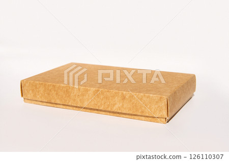 Rectangular brown cardboard box on white background for packaging and shipping Rectangular brown cardboard box on white background for packaging and shipping 126110307