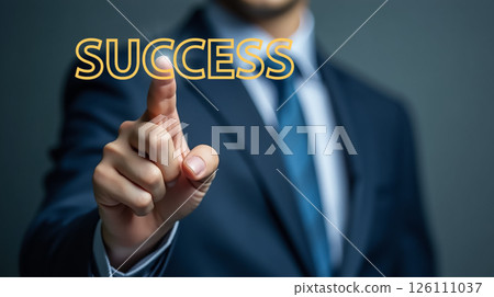 Business professional demonstrating achievement by touching the word success in a corporate setting during a presentation 126111037