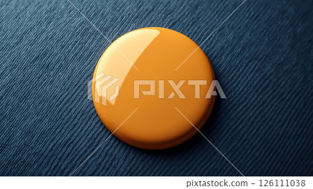Bright orange paint dot on textured blue fabric creates an eye-catching contrast and highlights art materials in use 126111038