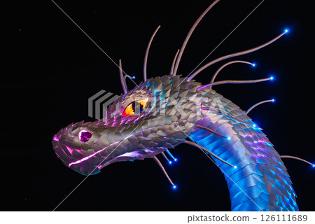 A vibrant dragon head sculpture with glowing eyes and light tipped tendrils, featuring intricate scales in blue, purple, and pink hues against a dark backdrop. 126111689