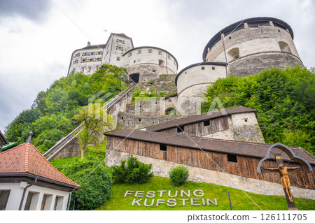 Nestled in the lush mountains of Tyrol, Kufstein Fortress stands tall with its impressive architecture and historical significance. Visitors can admire its grandeur and scenic surroundings. Nestled in the lush mountains of Tyrol, Kufstein Fortress stands tall with its impressive architecture and historical significance. Visitors can admire its grandeur and scenic surroundings. 126111705