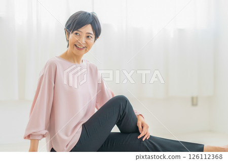A woman relaxing at home A woman relaxing at home 126112368