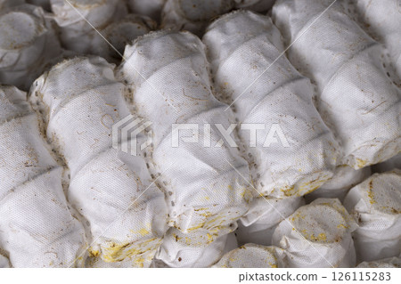 glued together old mattress springs in white fabric after long-term use glued together old mattress springs in white fabric after long-term use 126115283