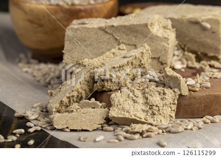 halva from sunflower seeds closeup, delicious dessert made from fried sunflower seeds 126115299