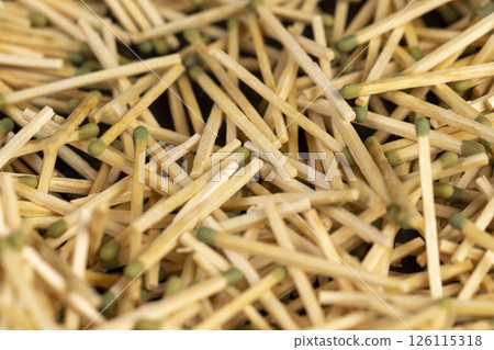 a large number of thin wooden matches with a head a large number of thin wooden matches with a head 126115318
