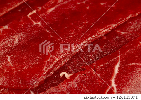 sliced beef jerky without cooking, beef dishes cut into thin slices and eaten raw 126115371