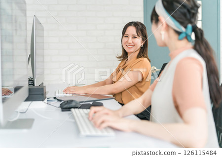 A woman who works as a photo editor, image editor, photo processor, retoucher, and graphic designer A woman who works as a photo editor, image editor, photo processor, retoucher, and graphic designer 126115484