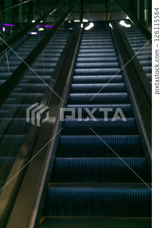 Escalator in a modern shopping center, closeup of photo Escalator in a modern shopping center, closeup of photo 126115564