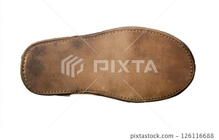 Close-up of a leather shoe sole with visible stitching and signs of wear. Medium brown color with smooth yet slightly worn texture. Quality craftsmanship and durability evident in the design. 126116688