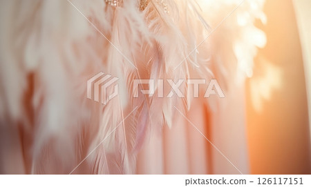 Close-up of blouse with feather accents in elegant boutique. Soft pastel tones and luxurious textures make this scene perfect for fashion and retail visuals. 126117151