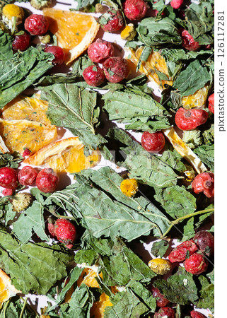 Dried Leaves, Fruit Pieces and Flower Heads Spread Out for Herbal Tea Ingredients. Natural Healthy Drink and Wellness Concepts. Dried Leaves, Fruit Pieces and Flower Heads Spread Out for Herbal Tea Ingredients. Natural Healthy Drink and Wellness Concepts. 126117281