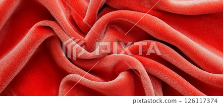 Red velvet fabric texture background with flowing folds and copy space 126117374