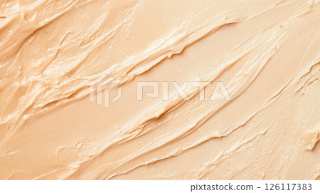 Close-up of creamy beige texture background with smooth swirls, perfect for copy space 126117383