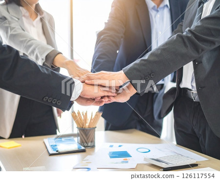 The hands of a business person clasping their hands together 126117554